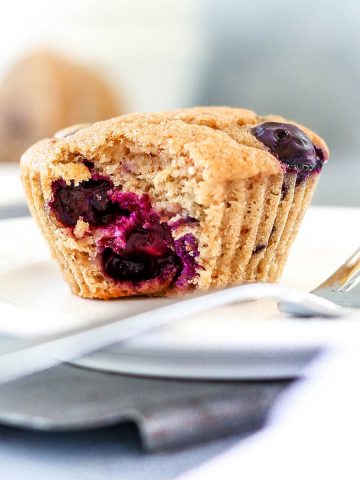 a blueberry muffin with a bite taken out