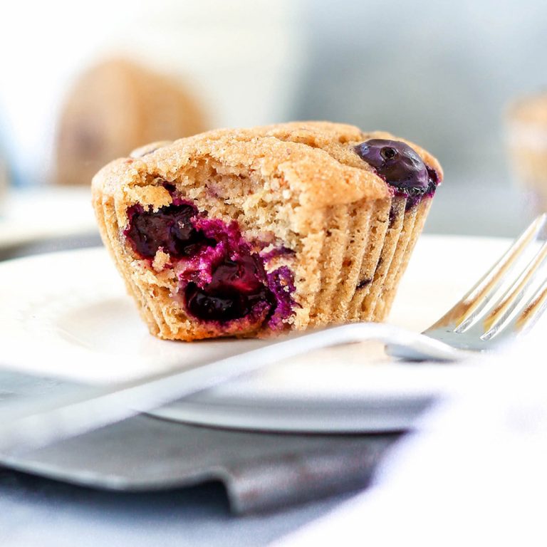 a blueberry muffin with a bite taken out