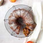 a vegan apple cake with powdered sugar topping