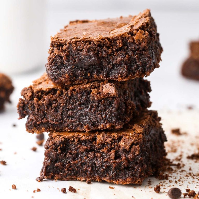 A stack of three soft and chewy dairy free brownies.