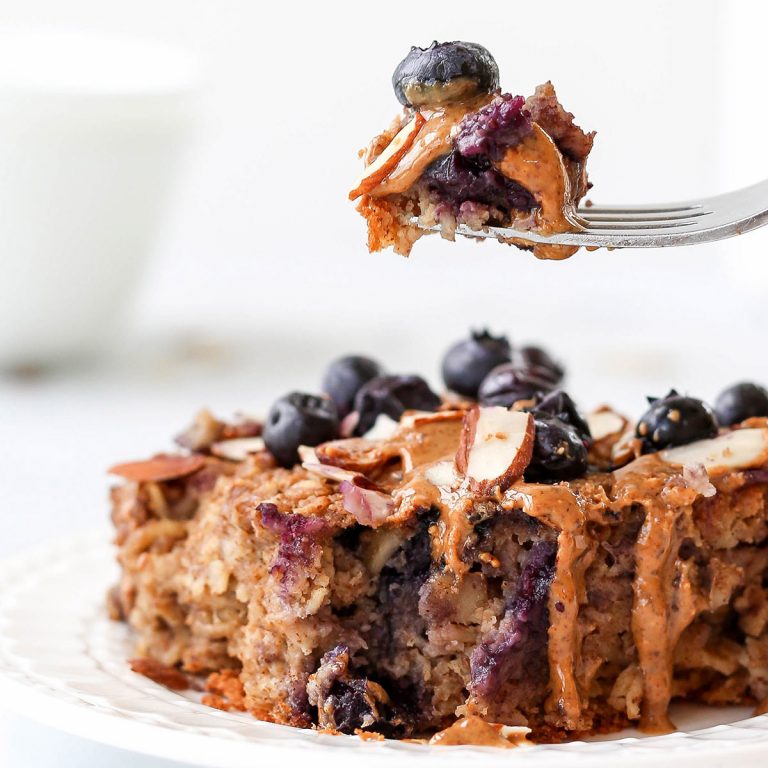 a fork picking up a bite of blueberry baked oatmeal