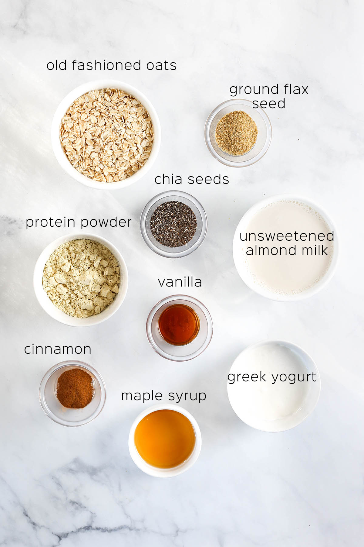 the ingredients to make protein overnight oats, set out on a table