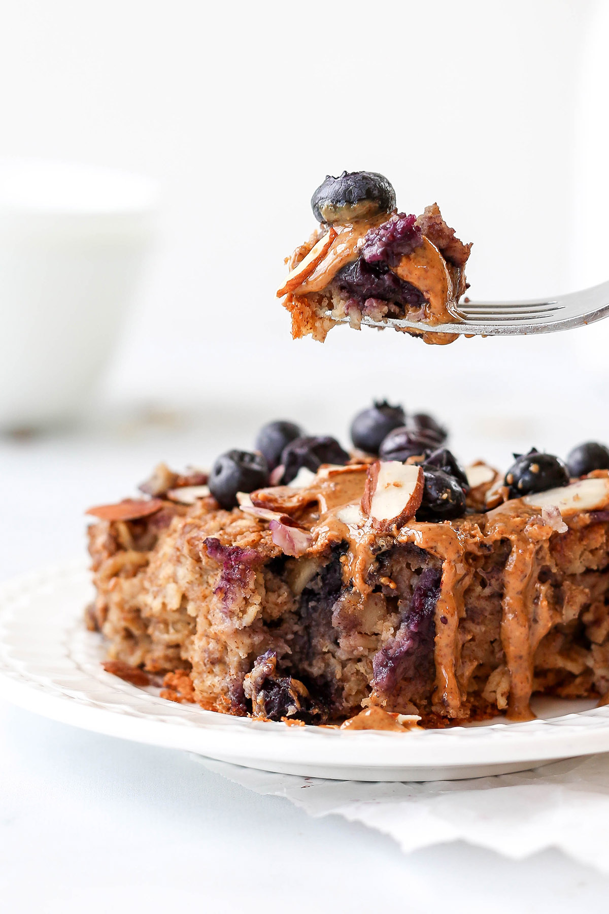 a fork digging into blueberry baked oatmeal.