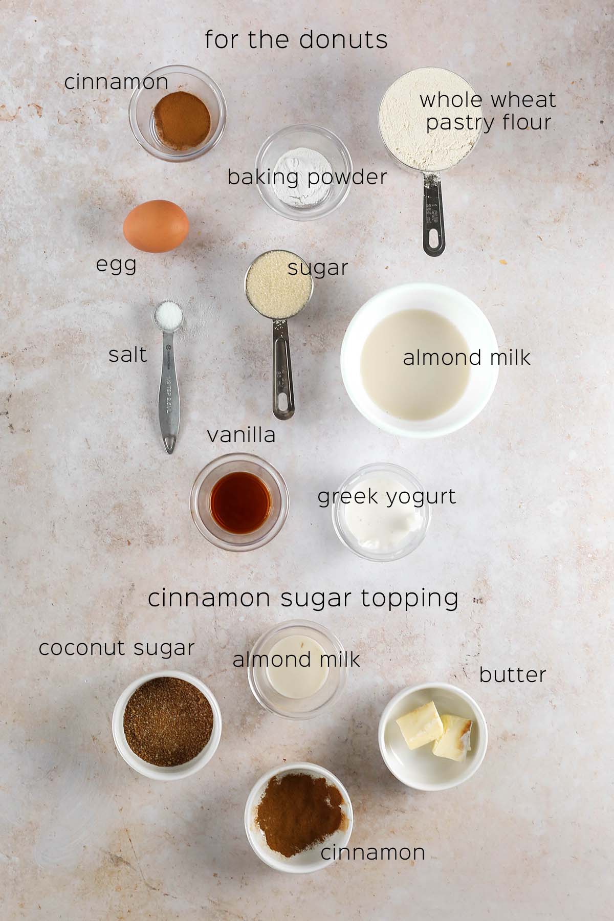 all of the ingredients needed to make the donuts and the cinnamon sugar topping, laid out on the table
