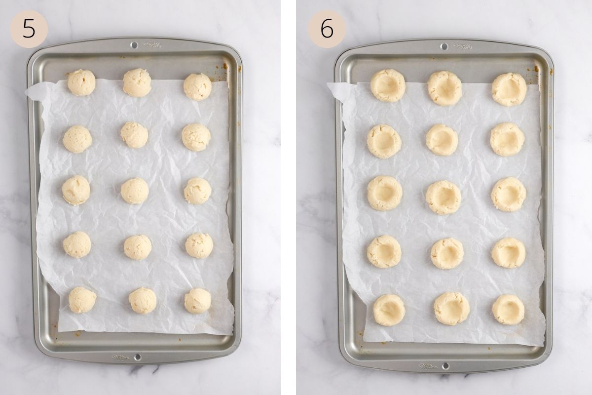 cookie dough balls on a baking sheet lined with parchment paper, with a thumbprint in the center of each cookie.