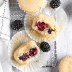 blackberry muffins on a gray tray.