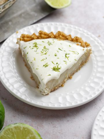 a slice of gluten free key lime pie with lime zest on top