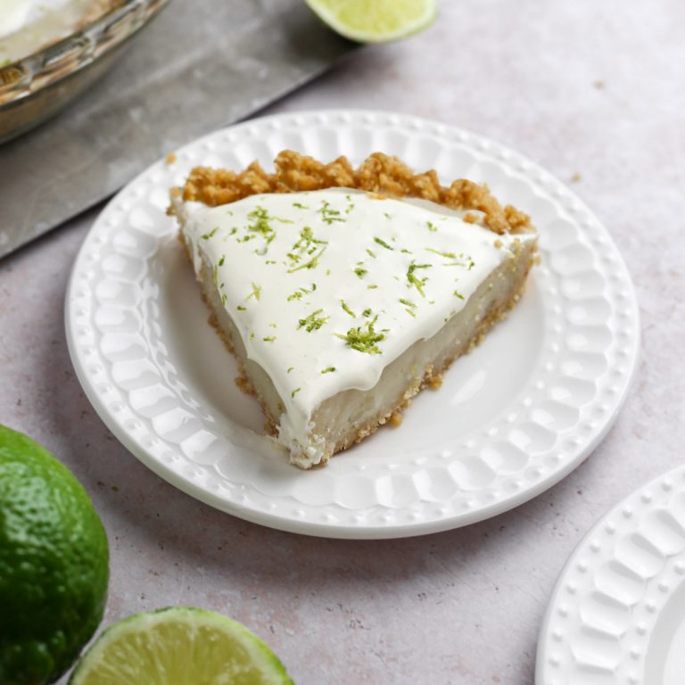 a slice of gluten free key lime pie with lime zest on top