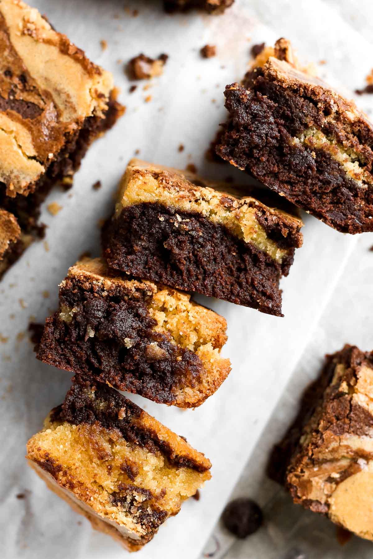 four brownie blondies shown together on their side, showcasing the layers of brownies and blondies.