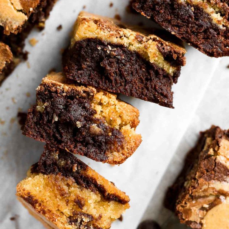 four brownie blondies turned on their side, showing the chocolate blondie swirl of the bars.