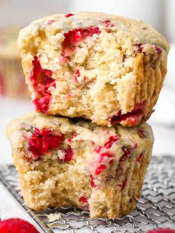 a stack of two vegan raspberry muffins.