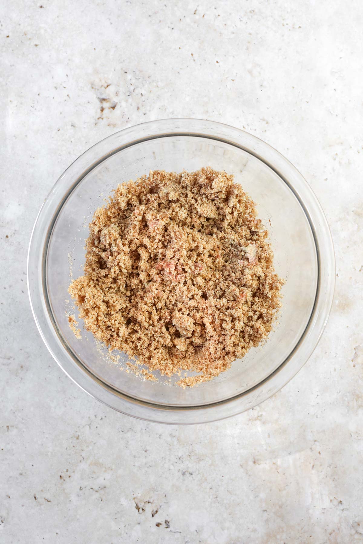 the mixed almond flour crumble topping in a bowl. It has a coarse texture.