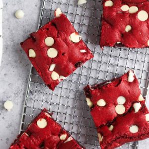 fudgy red velvet cake mix brownies with white chocolate on a silver tray.