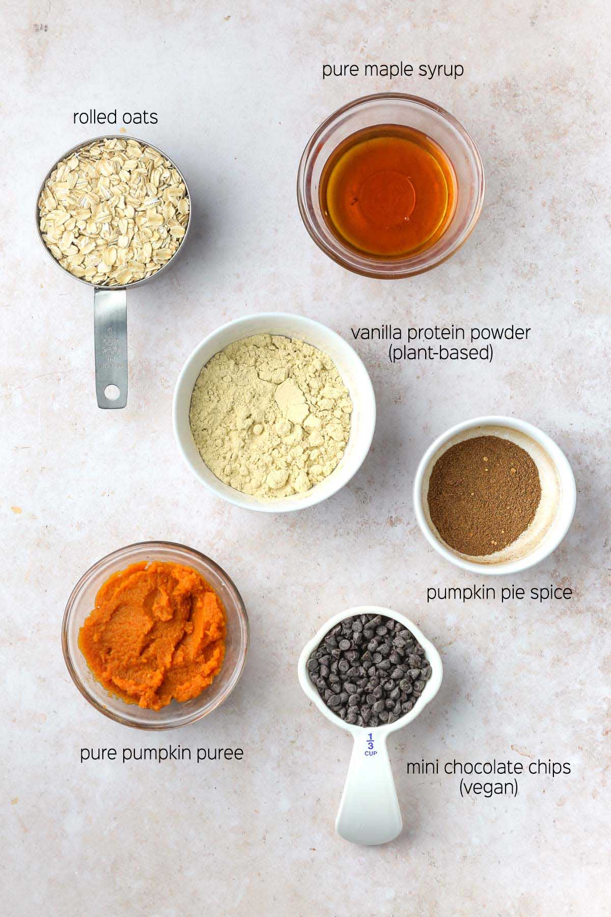 all ingredients to make the recipe prepared in bowls and measuring cups, shown from above on a marble surface.