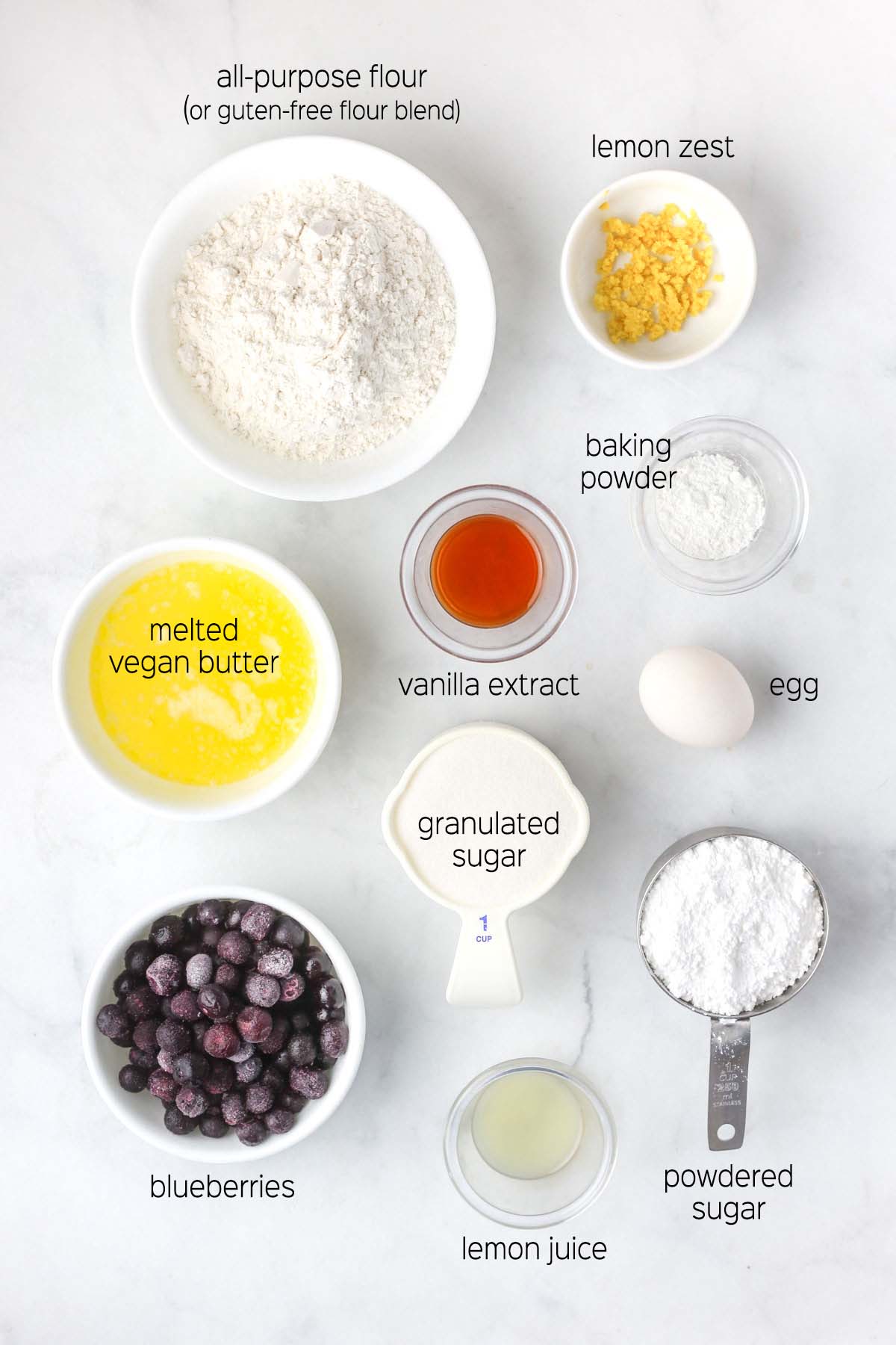 all ingredients to make the blondies prepared in small dishes, shown from above.