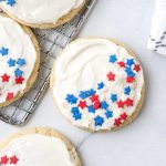 multiple 4th of july sugar cookies on a wire tray.
