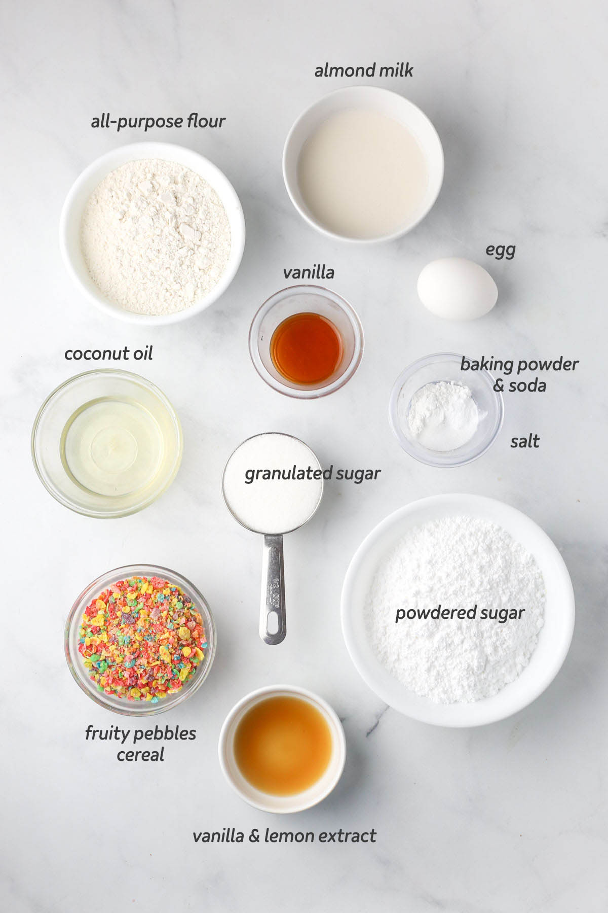 all ingredients to make the donuts shown from above, all prepared in small bowls.