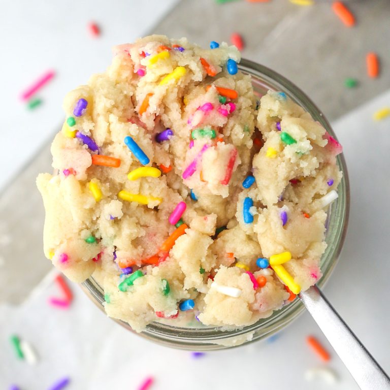 A jar of edible sugar cookie dough shown from above with sprinkles.